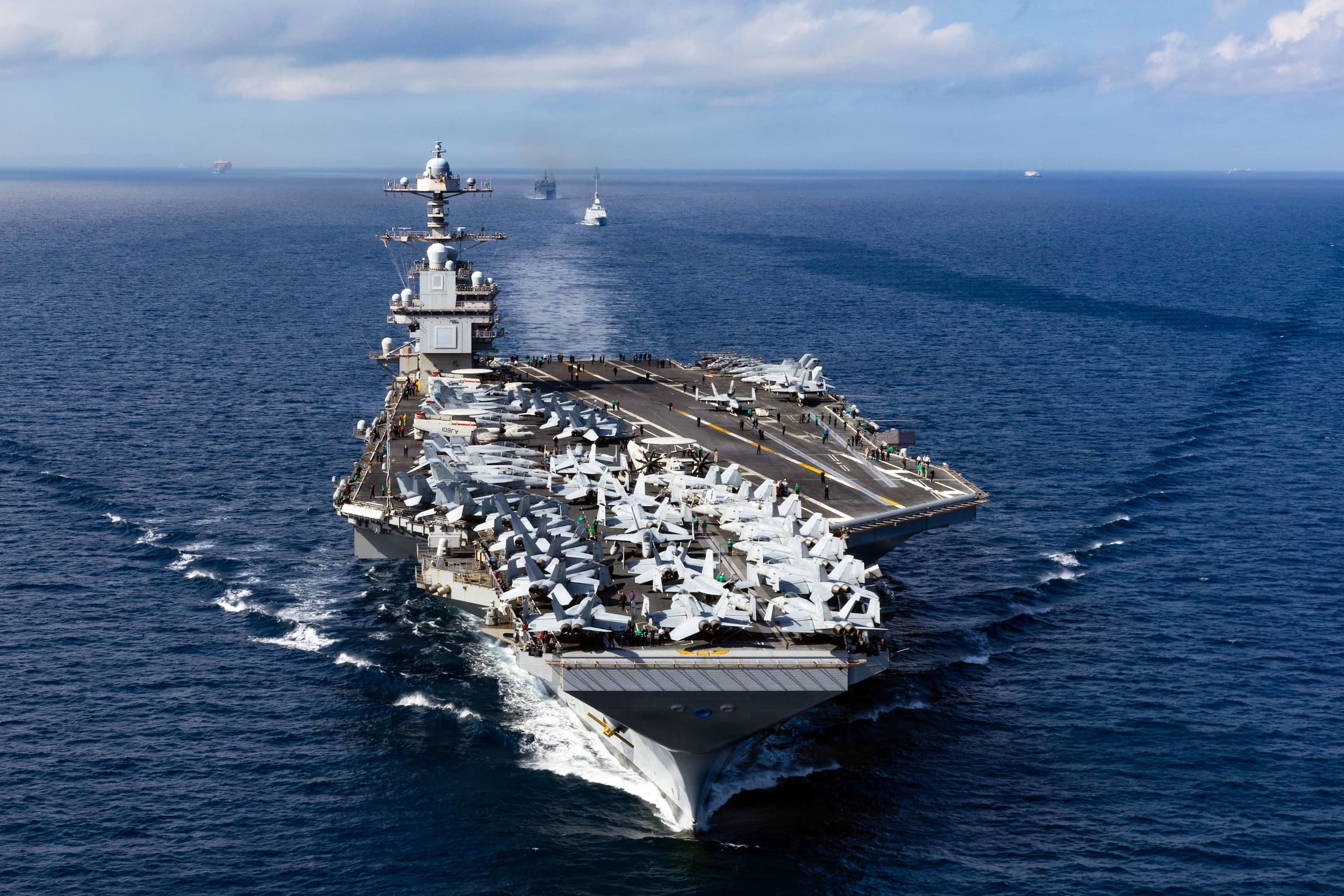 U.S. Navy service members near the water